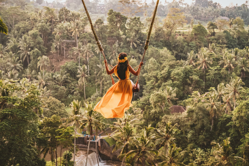 Woman in giant swing over the jungle